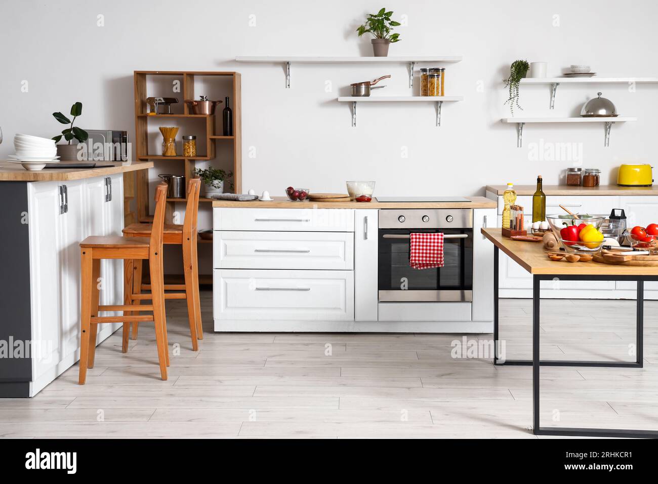 Interior of light kitchen with white counters, shelves and table Stock ...