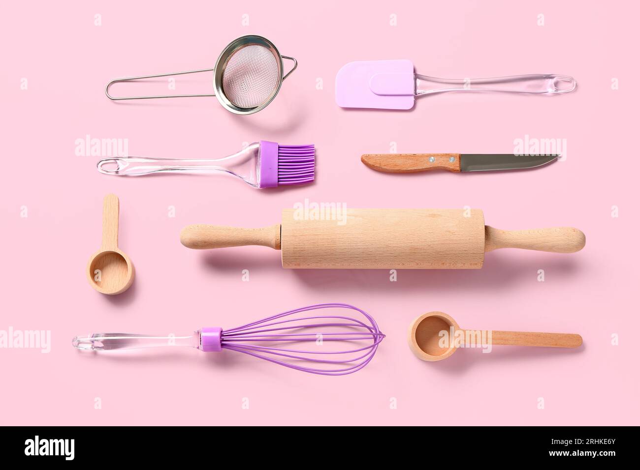 Baking utensils on pink background Stock Photo - Alamy