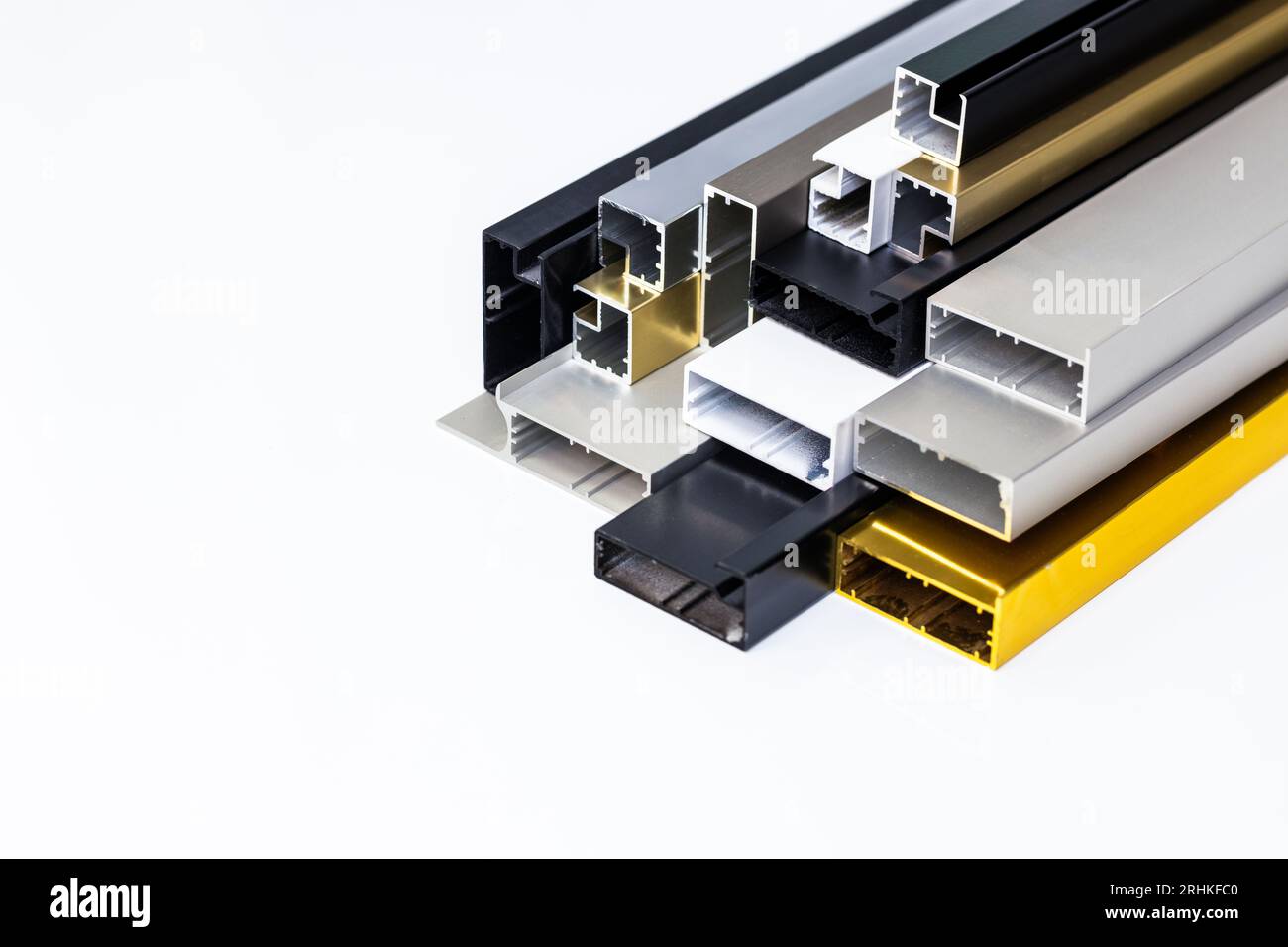 Aluminum profiles on a white background, Various shapes and colors ...