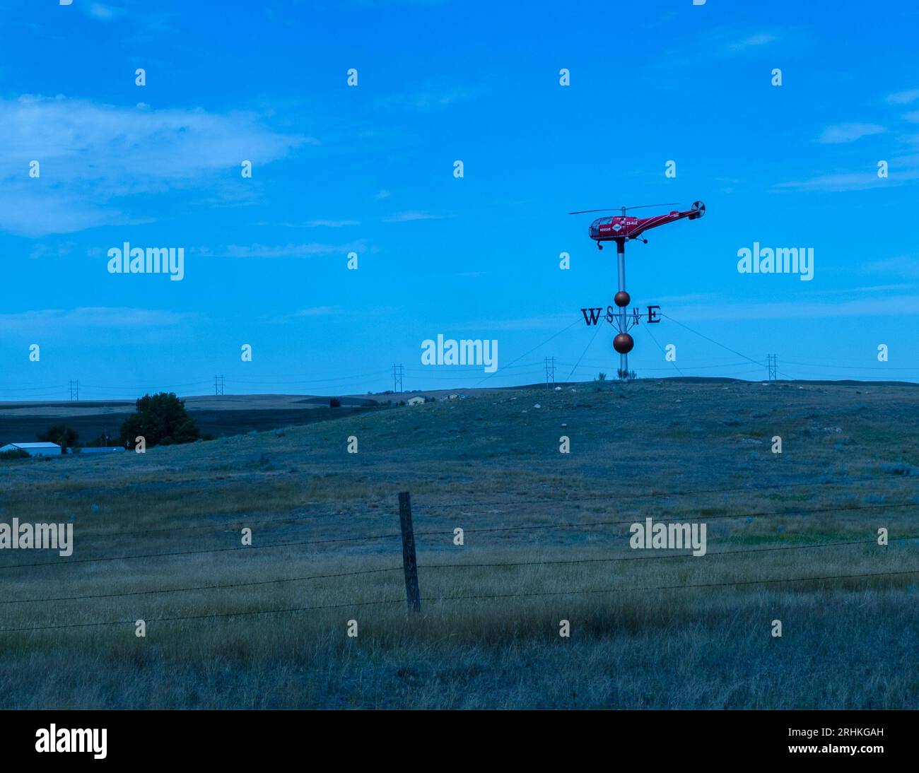 A life sized helicopter weather vane near Swift Current Saskatchewan. Stock Photo