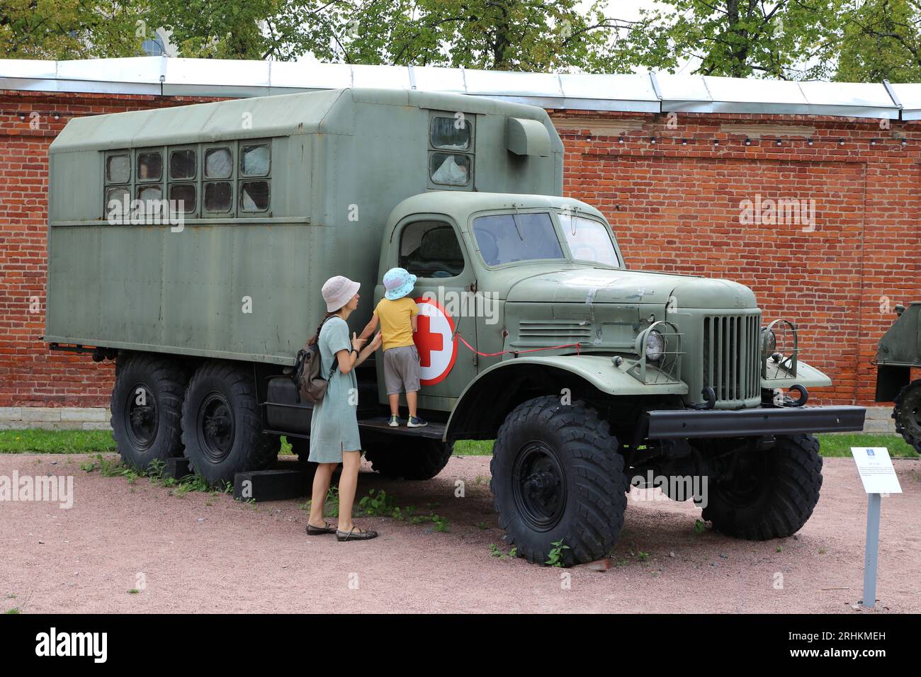 Kronstadt, Russia. 17th Aug, 2023. A girl and a child study a medical truck that was previously used by the Russian Army on the ground in the Military-Patriotic Park of Culture and Recreation of the Western Military District 'Patriot' in Kronstadt, near the city of Saint Petersburg, Russian Federation. Credit: SOPA Images Limited/Alamy Live News Stock Photo