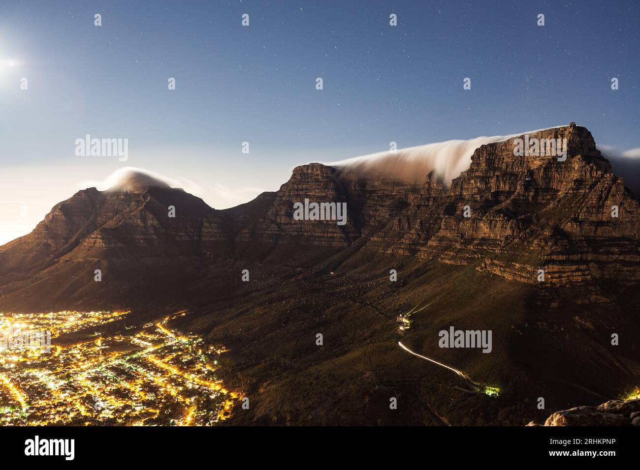 Night-scape landscape photograph of Table Mountain and Cape Town City South Africa from Lions Head and Signal Hill travel tourism Stock Photo