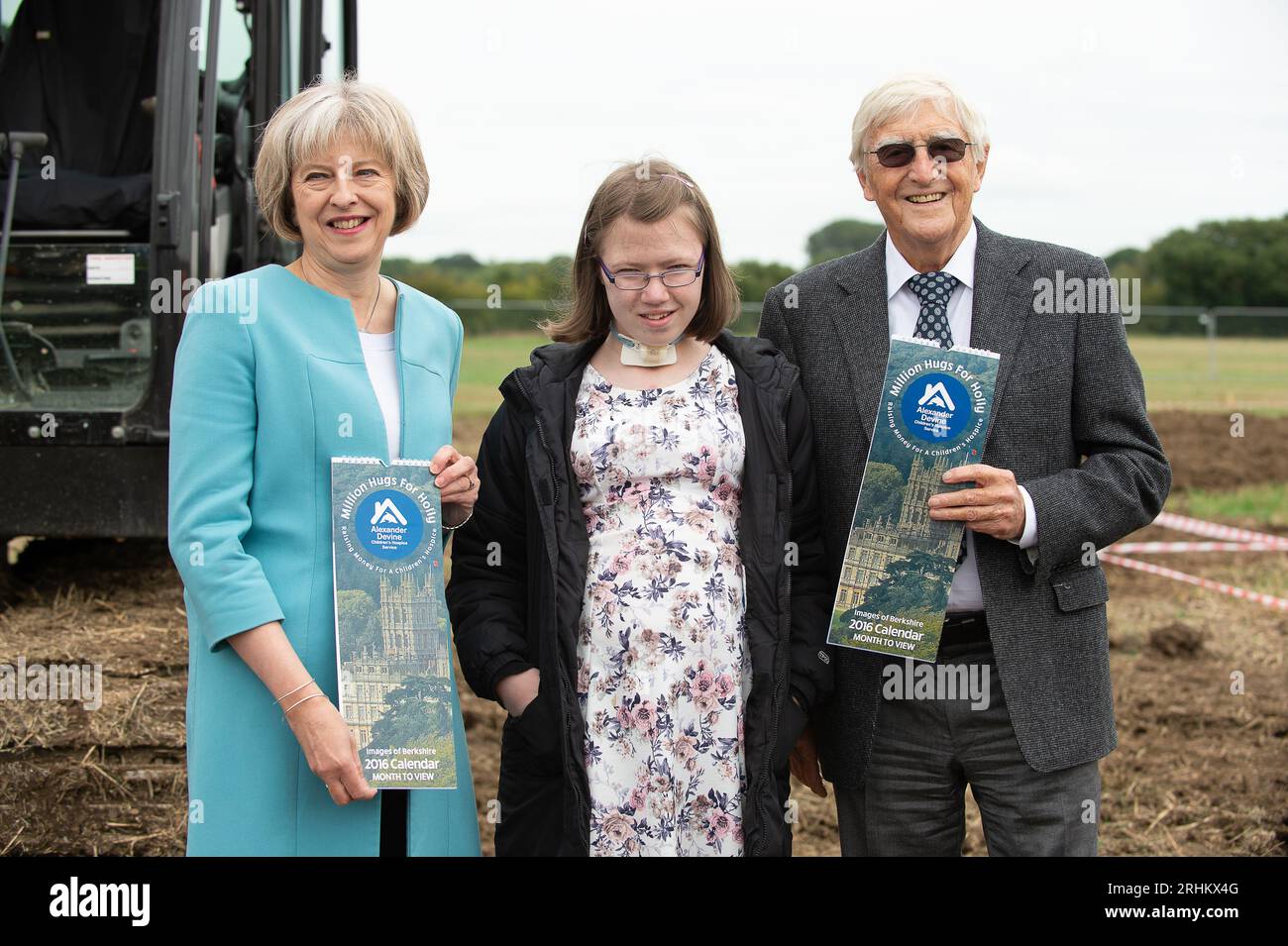 FILE PICS. 17th August, 2023. It has been announced today that sadly television host and presenter, Sir Michael Parkinson has died aged 88. Sir Michael Parkinson is pictured at the breaking the ground ceremony of the Alexander Divine Children's Hospice in Woodlands Park near Maidenhead, Berkshire with fundraiser Holly (M) and guest of honour The Rt Hon Theresa May (L) MP for Maidenhead. Credit: Maureen McLean/Alamy Stock Photo