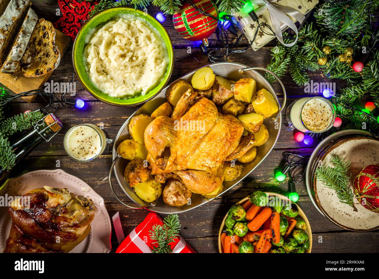 Festive Christmas dinner table with traditional foods and dished ...