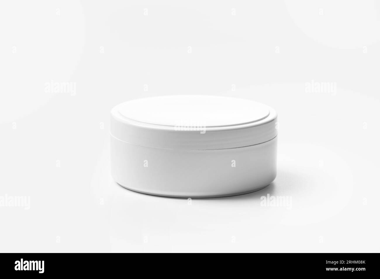 White plastic jar for cosmetic products for face and body skin care, hair, isolated on a white background. Packaging layout for cream, masks, scrub. Stock Photo