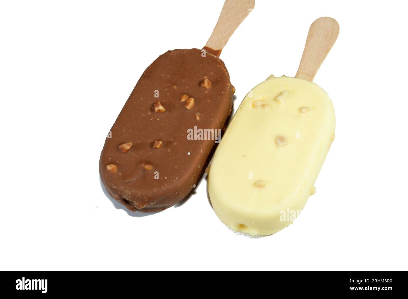 Rich vanilla flavored ice creams in cracking brown and white milk chocolate and roasted almond, Vanilla ice cream sticks coated and covered with a lay Stock Photo