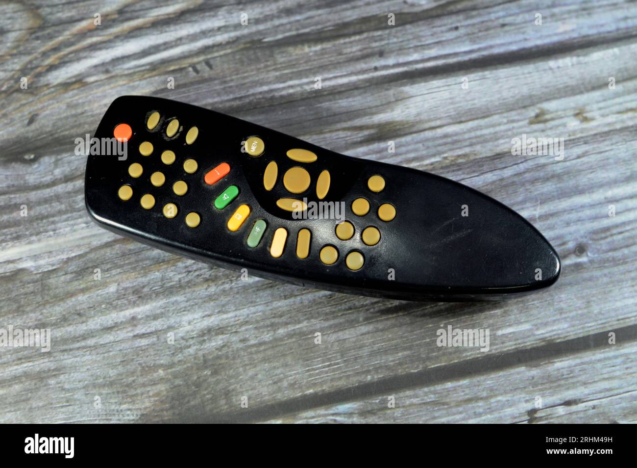 An old used remote control or a clicker, an electronic device used to ...