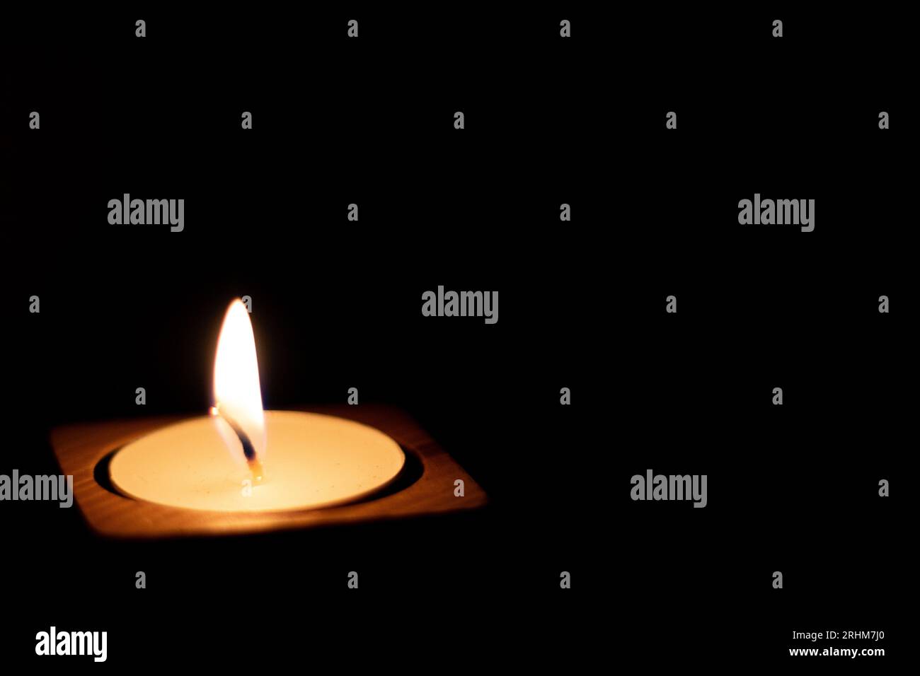Light and Shadows on a Person Burning Letters into Wood Stock Photo