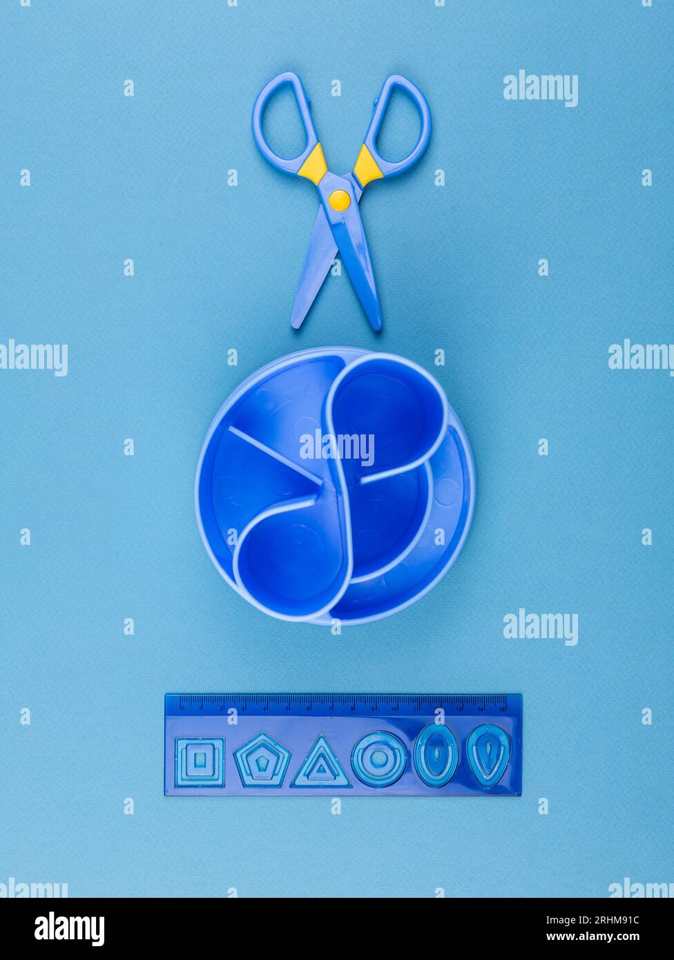 Blue desktop organizer with school stationary and office supplies over ...