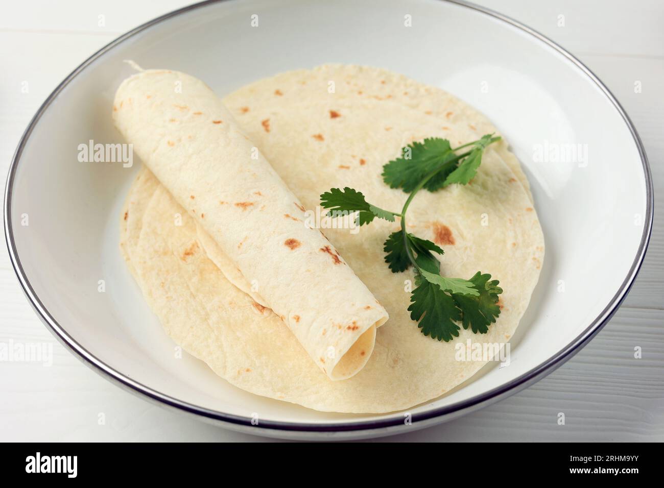 Plain Wheat Tortilla Wrap on White Background, Close Up Stock Photo