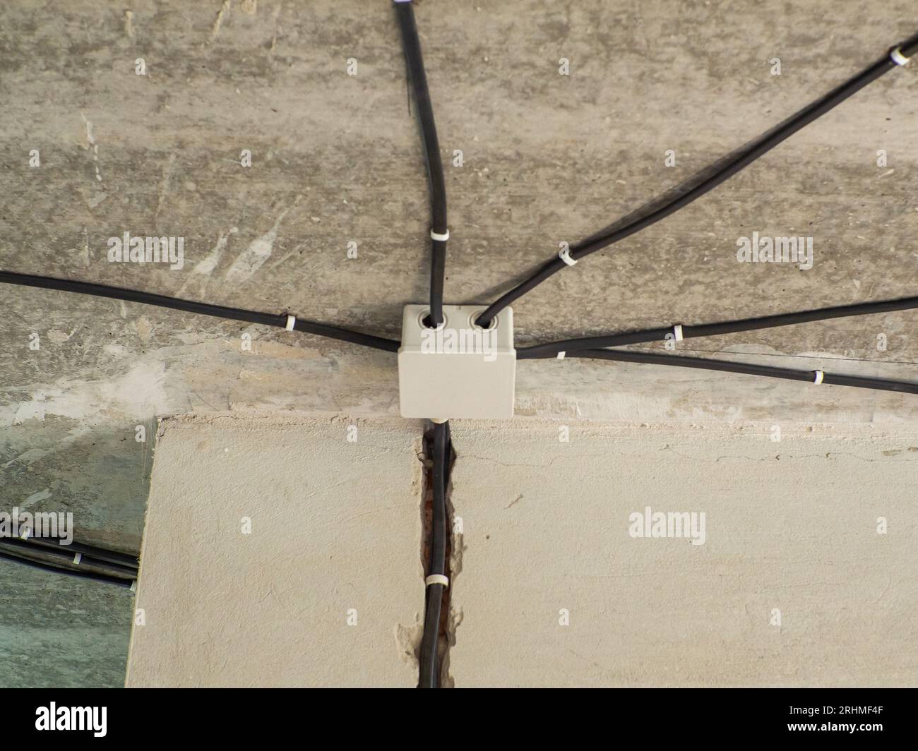 White plastic electric junction box with conduits install in house