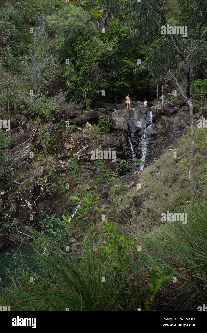 Young female visitors to Attie Creek Falls, Girringun National Park, near Cardwell, Queensland, Australia. No MR Stock Photo