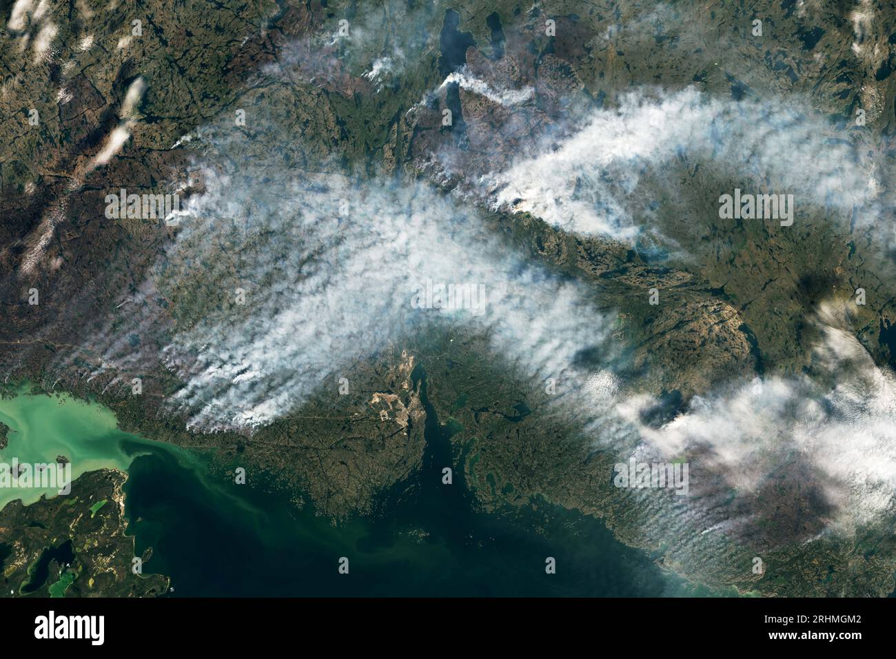 Canada. 16th Aug, 2023. Large wildland fires burning around Yellowknife have prompted Canadian authorities to issue evacuation orders for the city and other nearby communities. The city, the capital of the Northwest Territories, is home to about 20,000 people. The Operational Land Imager (OLI) on Landsat 8 captured an image (top of the page) showing several fires burning near Yellowknife at about 12:50 p.m. local time on August 16, 2023. Credit: NASA Earth/ZUMA Press Wire/ZUMAPRESS.com/Alamy Live News Stock Photo