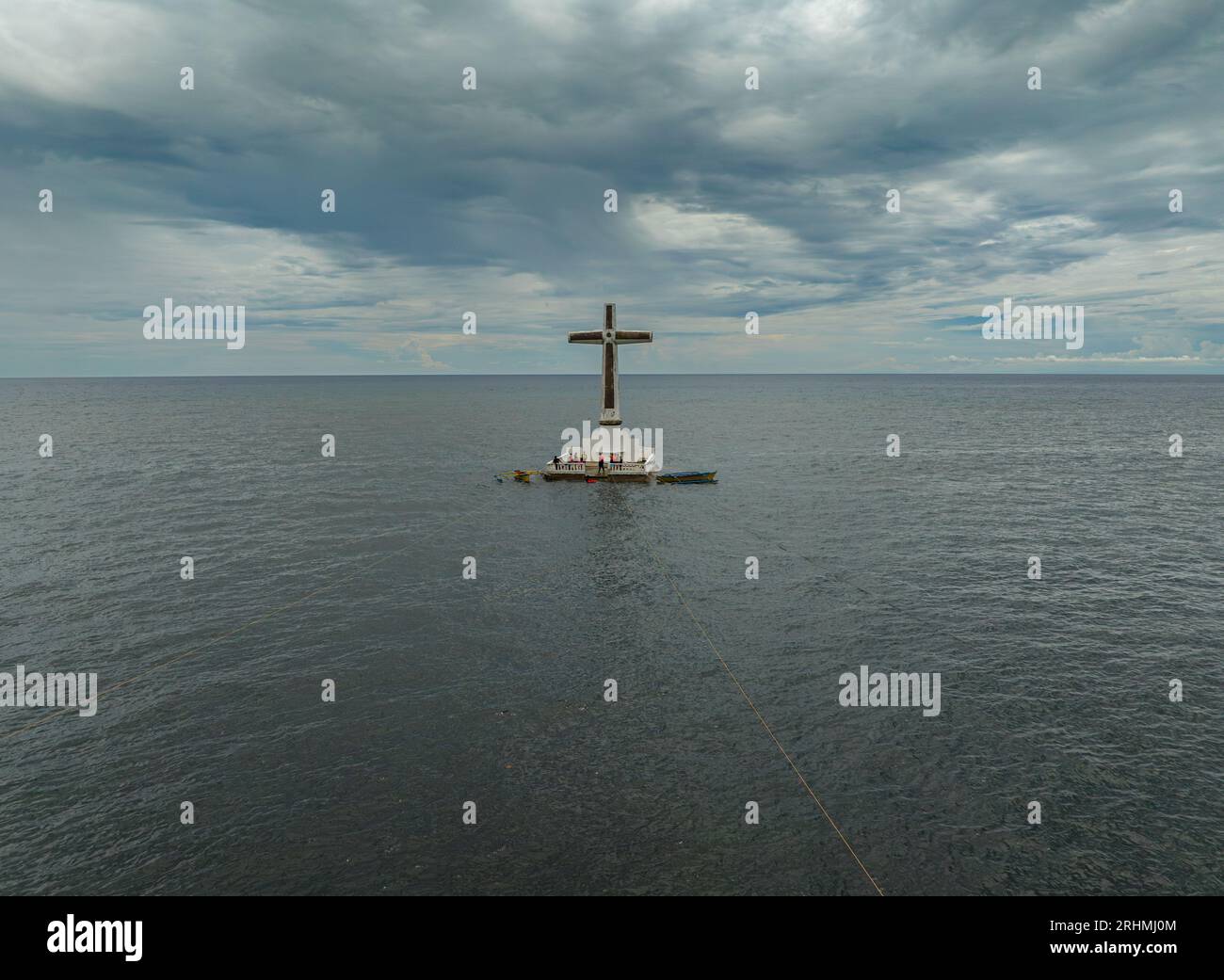 Sunken Cemetery with grayish sea water under stormy clouds in Camiguin Island. Philippines. Stock Photo