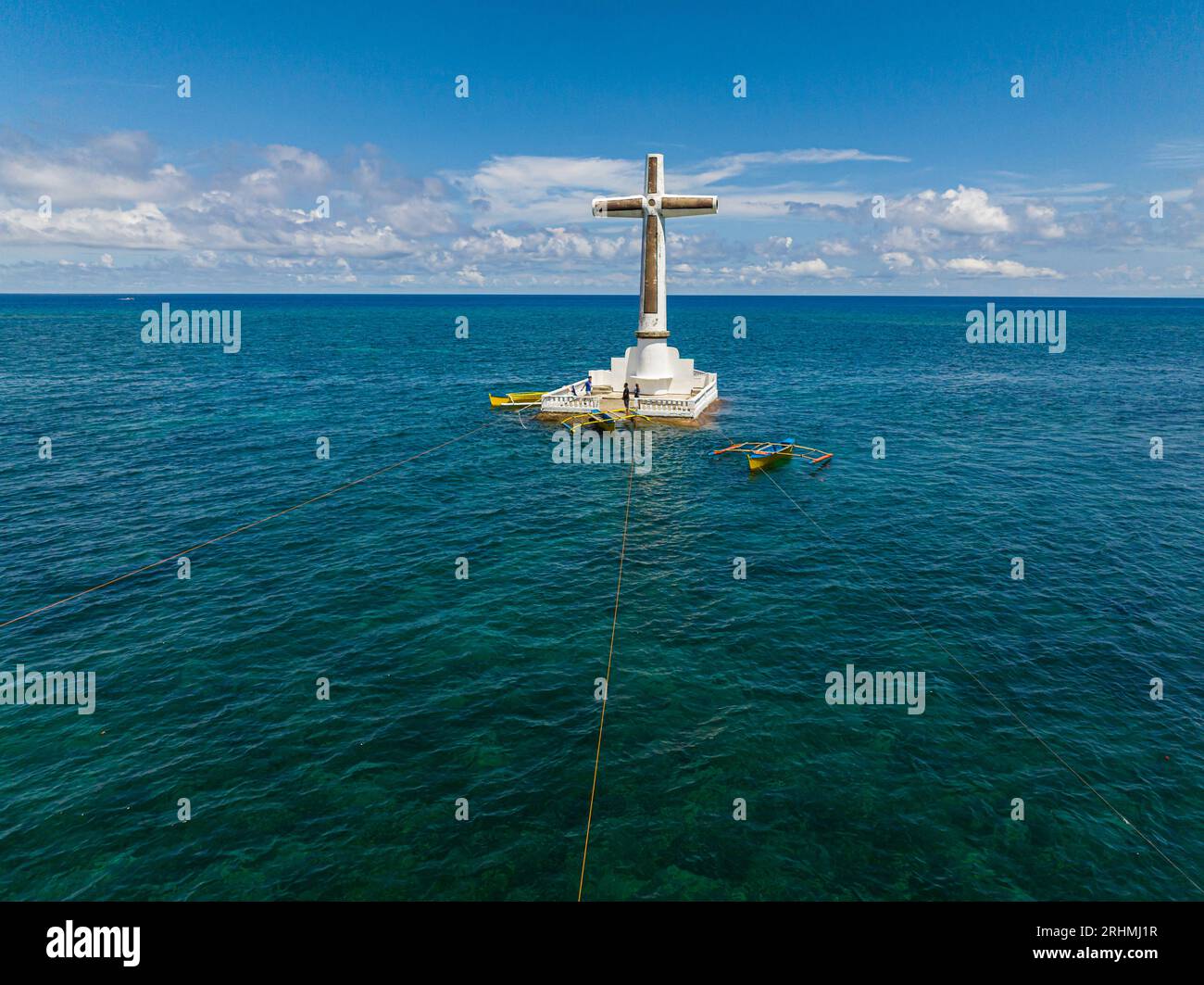 Sunken Cemetery in Camiguin Island. Group of boat floating over the sea. Philippines. Stock Photo
