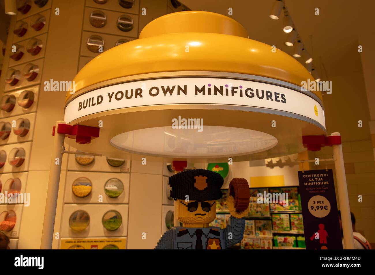 Milan , Italy  - 08 17 2023 : Lego build your own minifigures yellow in the Lego Store on white background Stock Photo