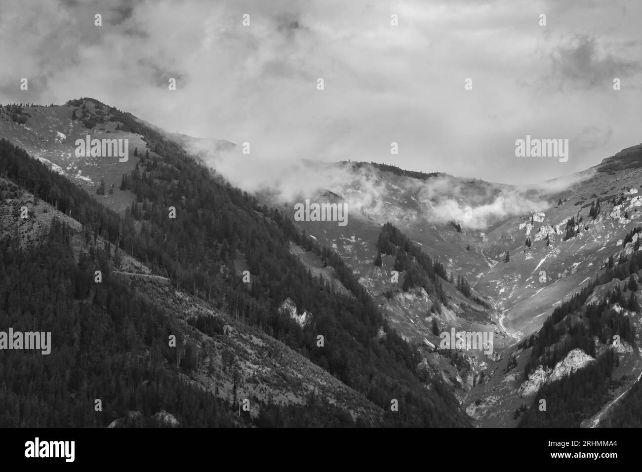 Alps mountains in stormy clouds, in black and white Stock Photo - Alamy