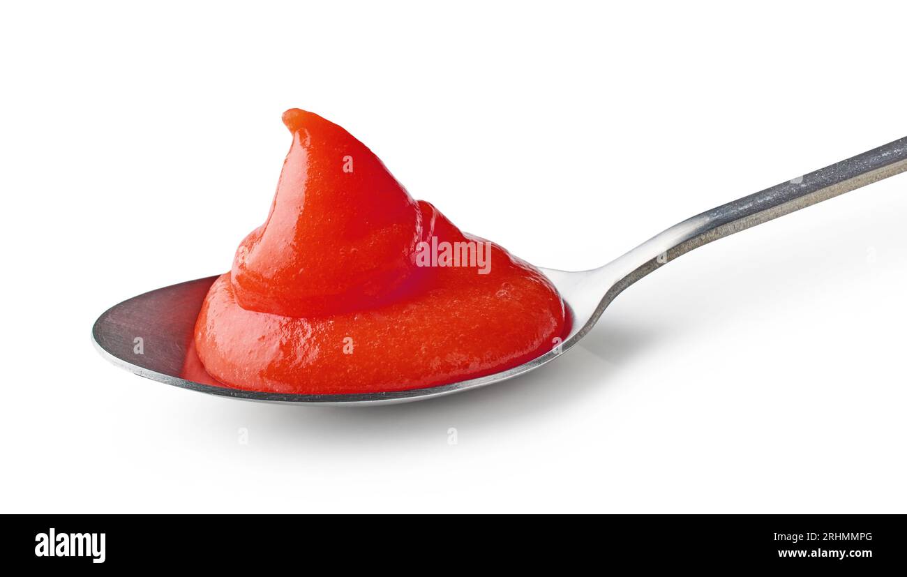tomato ketchup puree in a spoon isolated on white background Stock