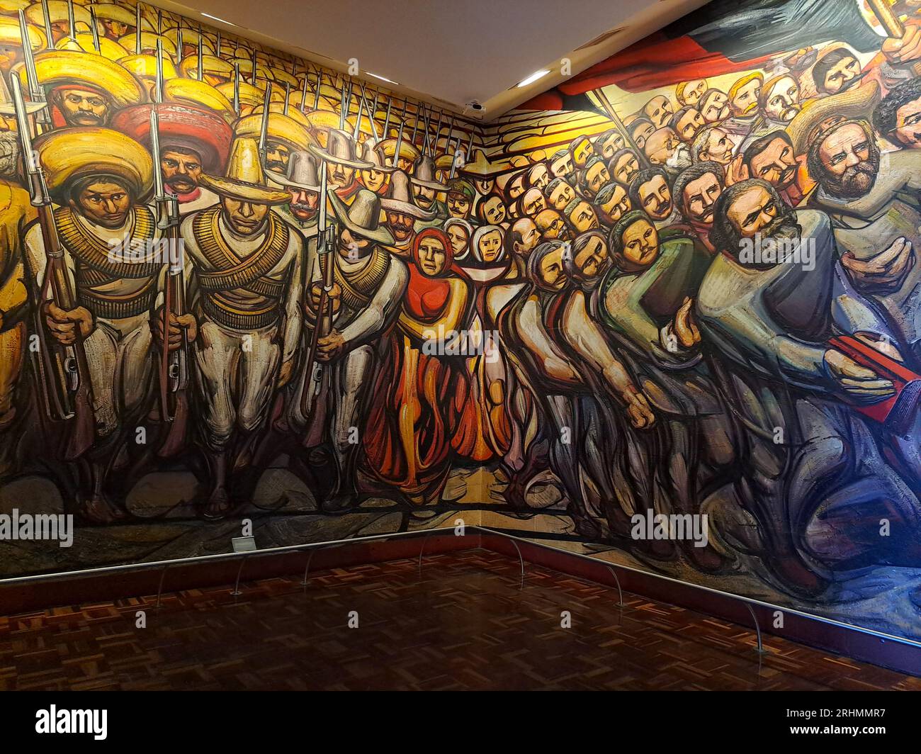 Mexico City, Mexico - August 9, 2023: Mural From Porfirismo to the Revolution by painter David Alfaro Siqueiros inside the National Museum of History Stock Photo