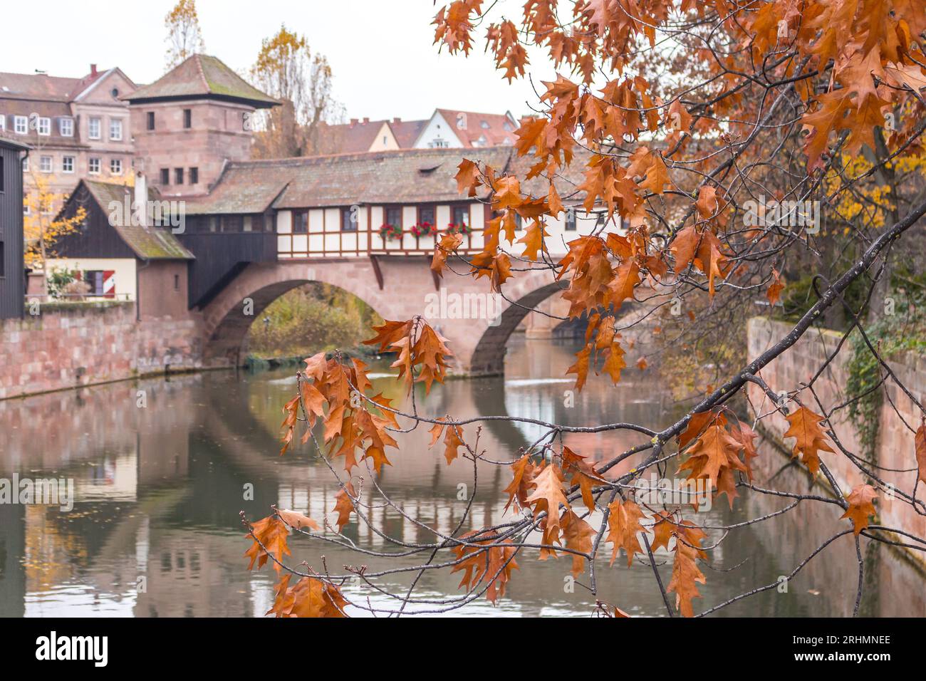 Nuremberg Altstadt landmark. Medieval houses and Henkersteg bridge over Pegnitz river. Old town of Nuremberg, Germany. Autumn landscape in old town. Stock Photo