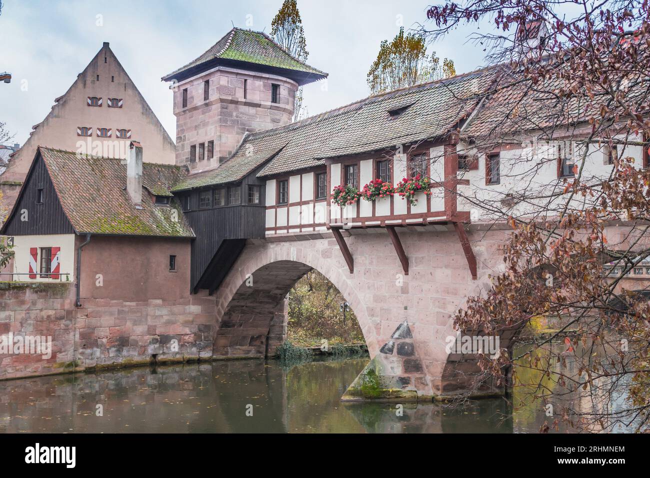 Nuremberg Altstadt landmark. Medieval houses and Henkersteg bridge over Pegnitz river. Old town of Nuremberg, Germany. Autumn landscape in old town. Stock Photo