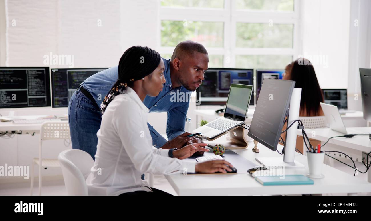 African Business Team Working On Computer. Software App Development Stock Photo