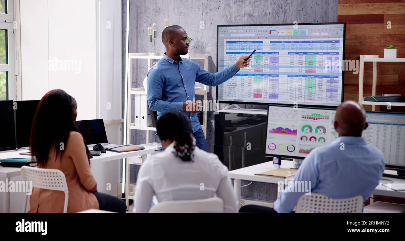 Corporate Training Presentation In Classroom With Computers Stock Photo ...