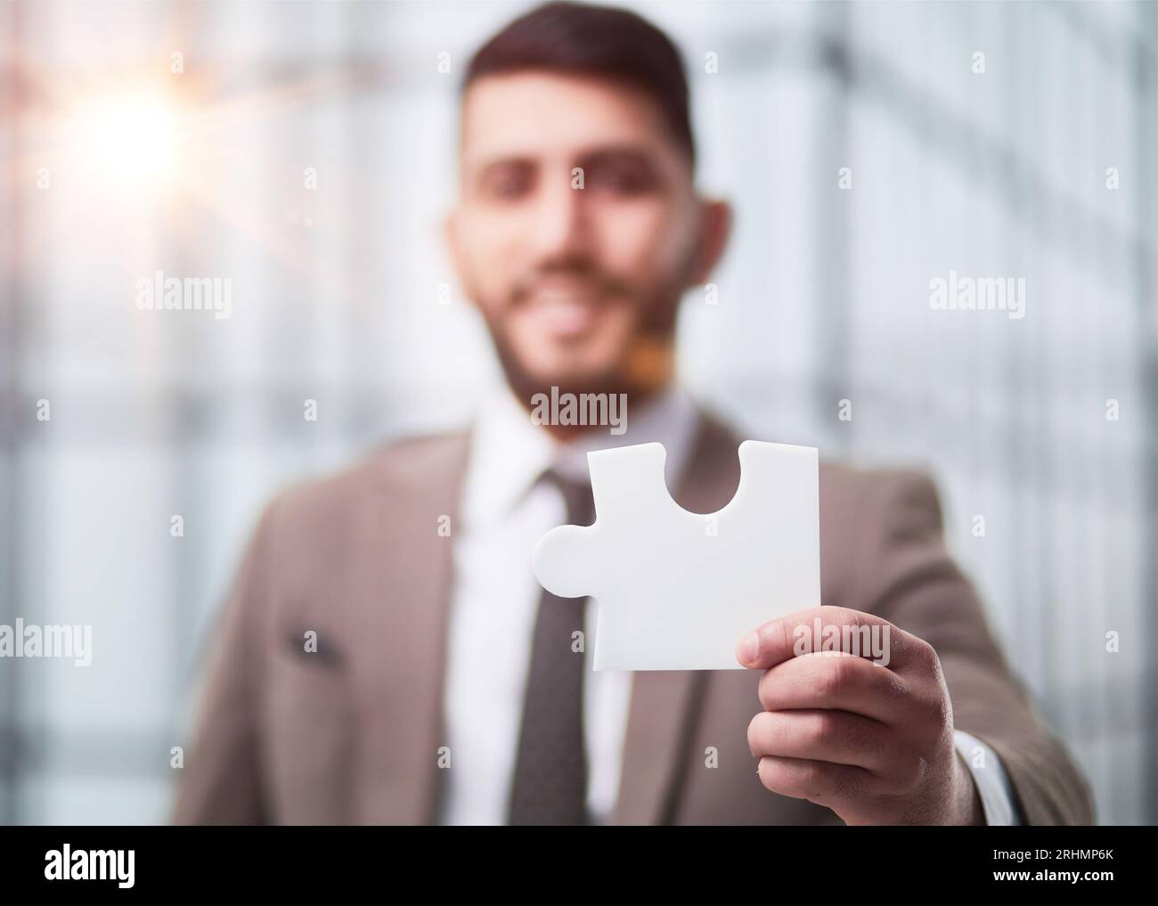 People holds in hand a jigsaw puzzle. Business solutions, success and