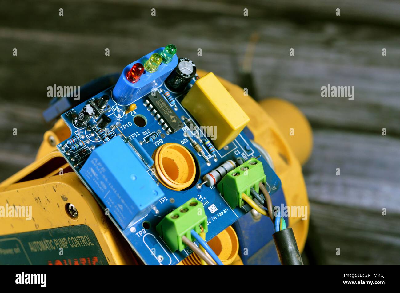 Cairo, Egypt, July 26 2023: Burnt water pump automatic pressure control electronic switch circuit board, Electronic board that was burnt due to electr Stock Photo