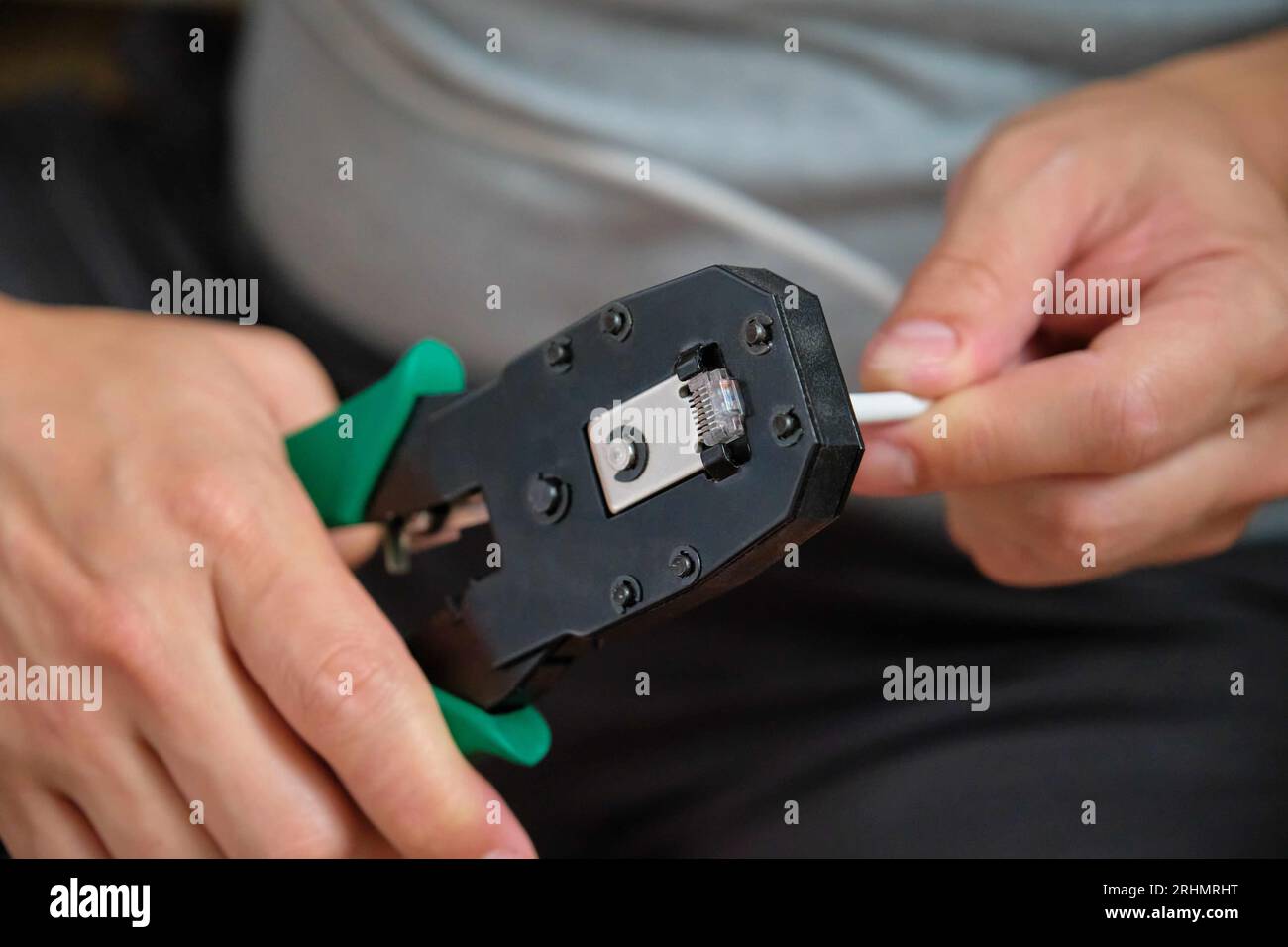 Hands ethernet cable router hi-res stock photography and images - Alamy
