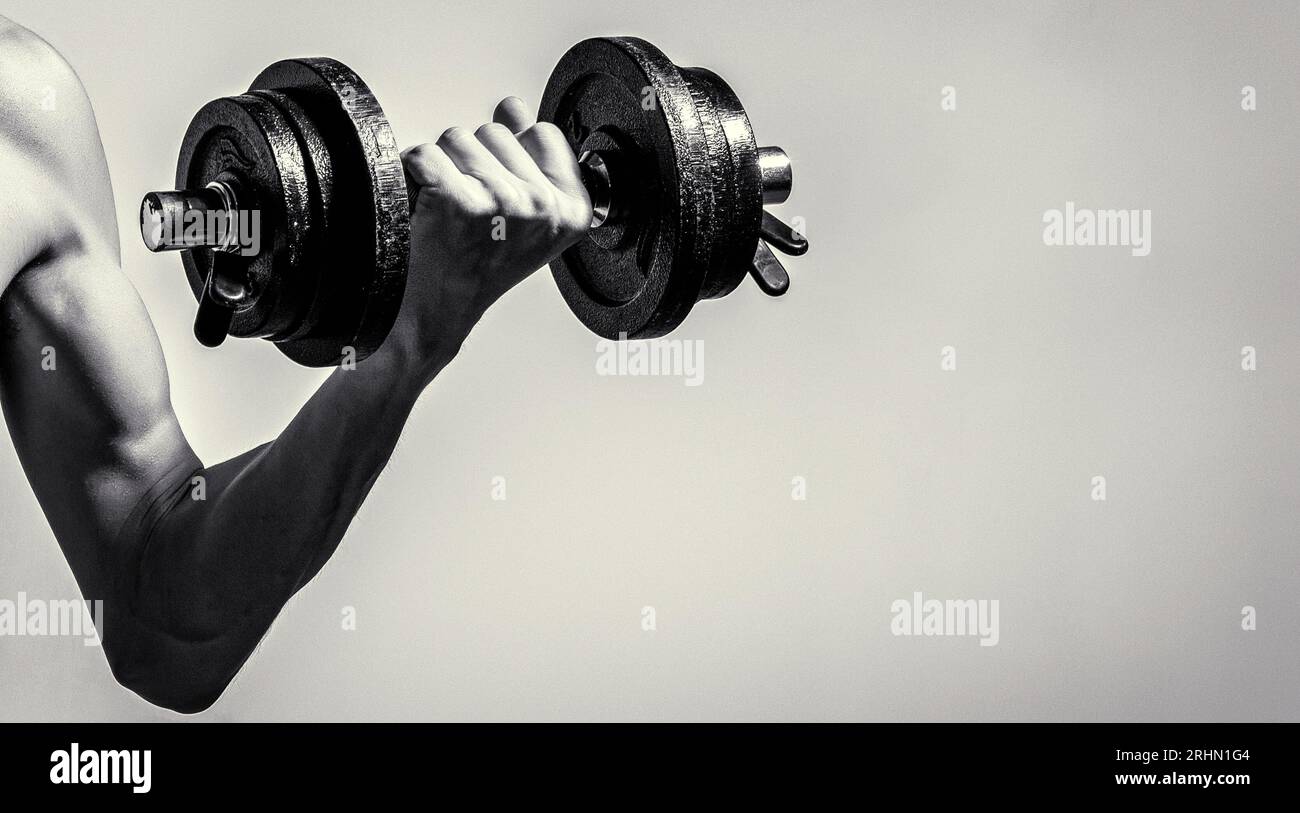 Weak man lift a weight, dumbbells, biceps, muscle, fitness. Man holding