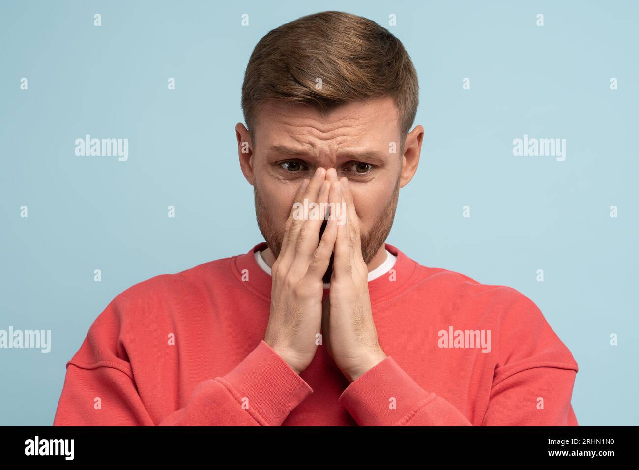 Frustrated man covered face with hands. Grief, sorrow, loss, collapse, distress concept Stock Photo