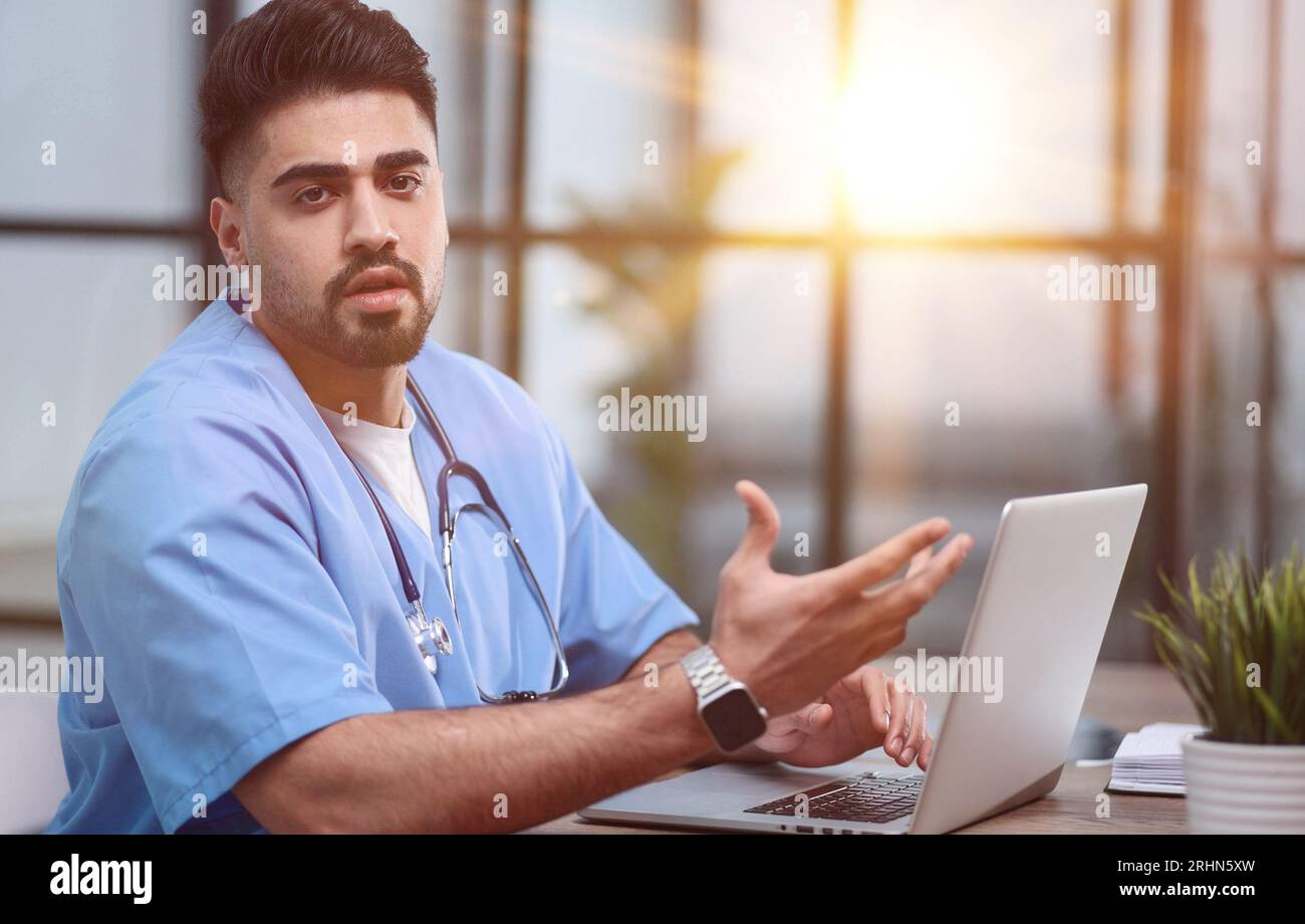Serious professional general practitioner looking at the camera Stock Photo