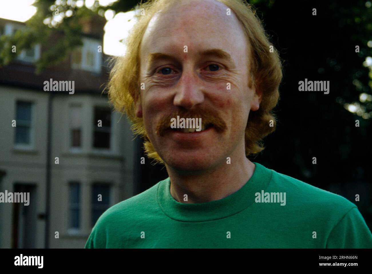 Portrait of Man in His Late 40's with Ginger hair and Moustache Smiling Stock Photo