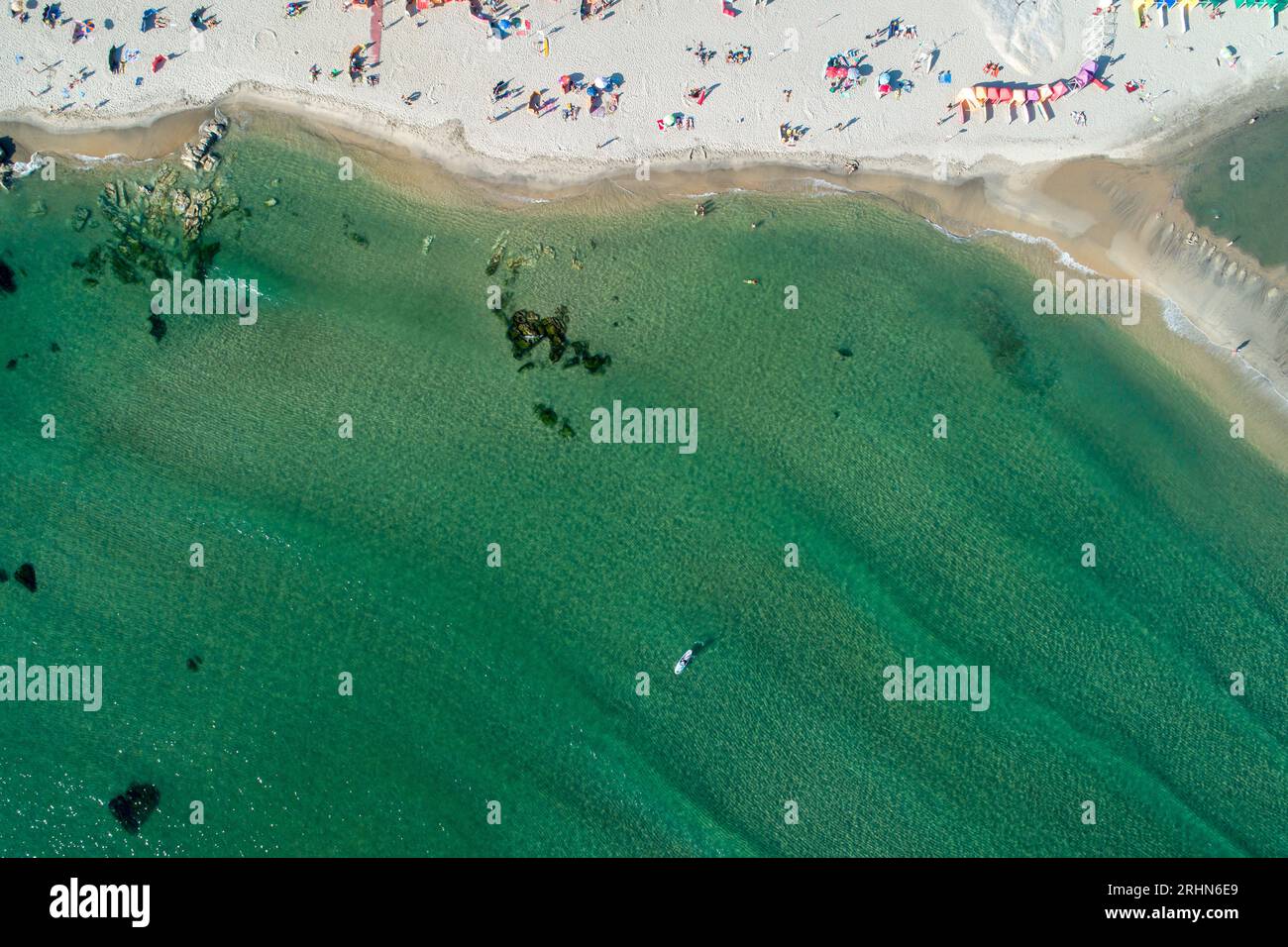 zenithal aerial view of a beach with people enjoying the summer Stock Photo