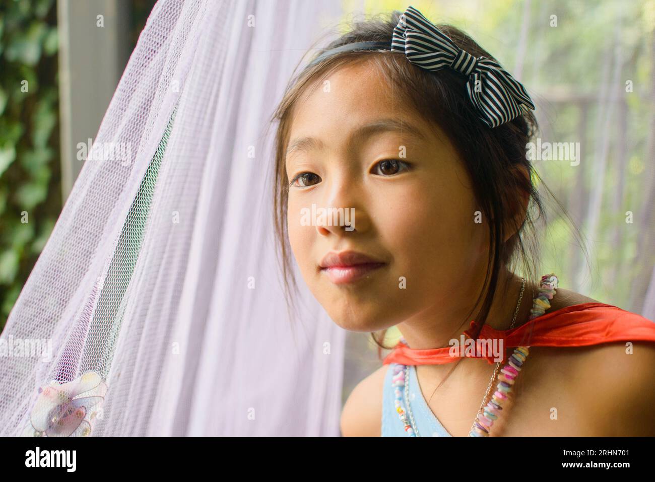 Vietnamese  American 7 year girl showinging off her  favorite outfits Stock Photo