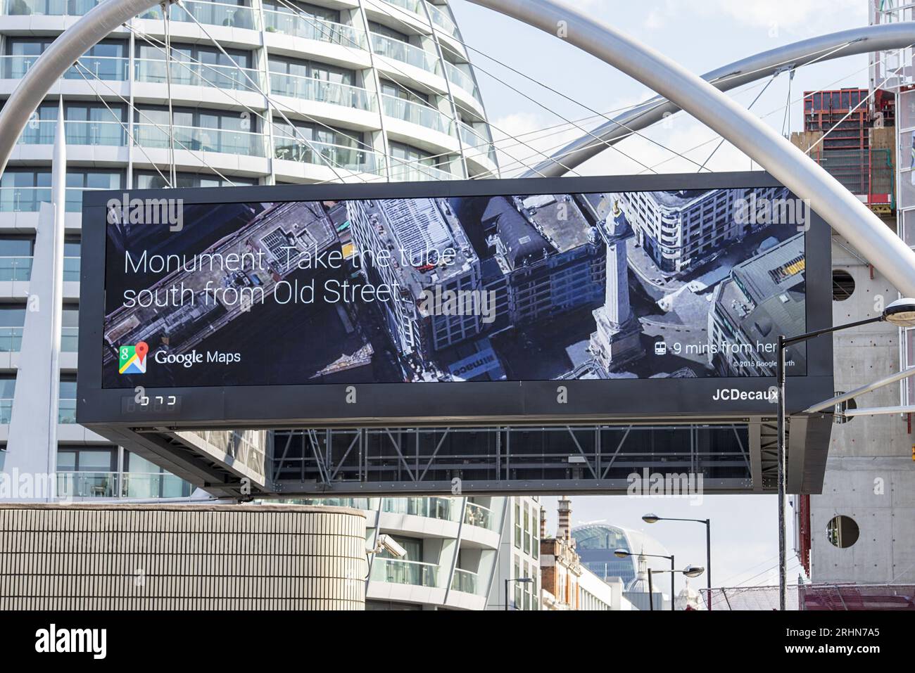 Digital Google Maps billboard at Old Street London displaying Monument Tube directions Stock Photo