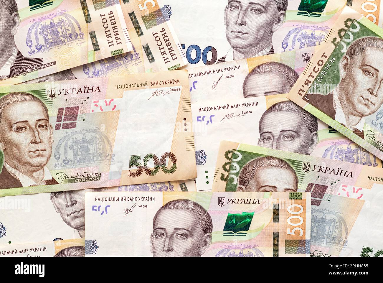 Kyiv, Ukraine - August 18, 2023: Ukrainian money currency of denominations scattered. Hryvnia banknotes 500 background. Money of Ukraine. Stock Photo
