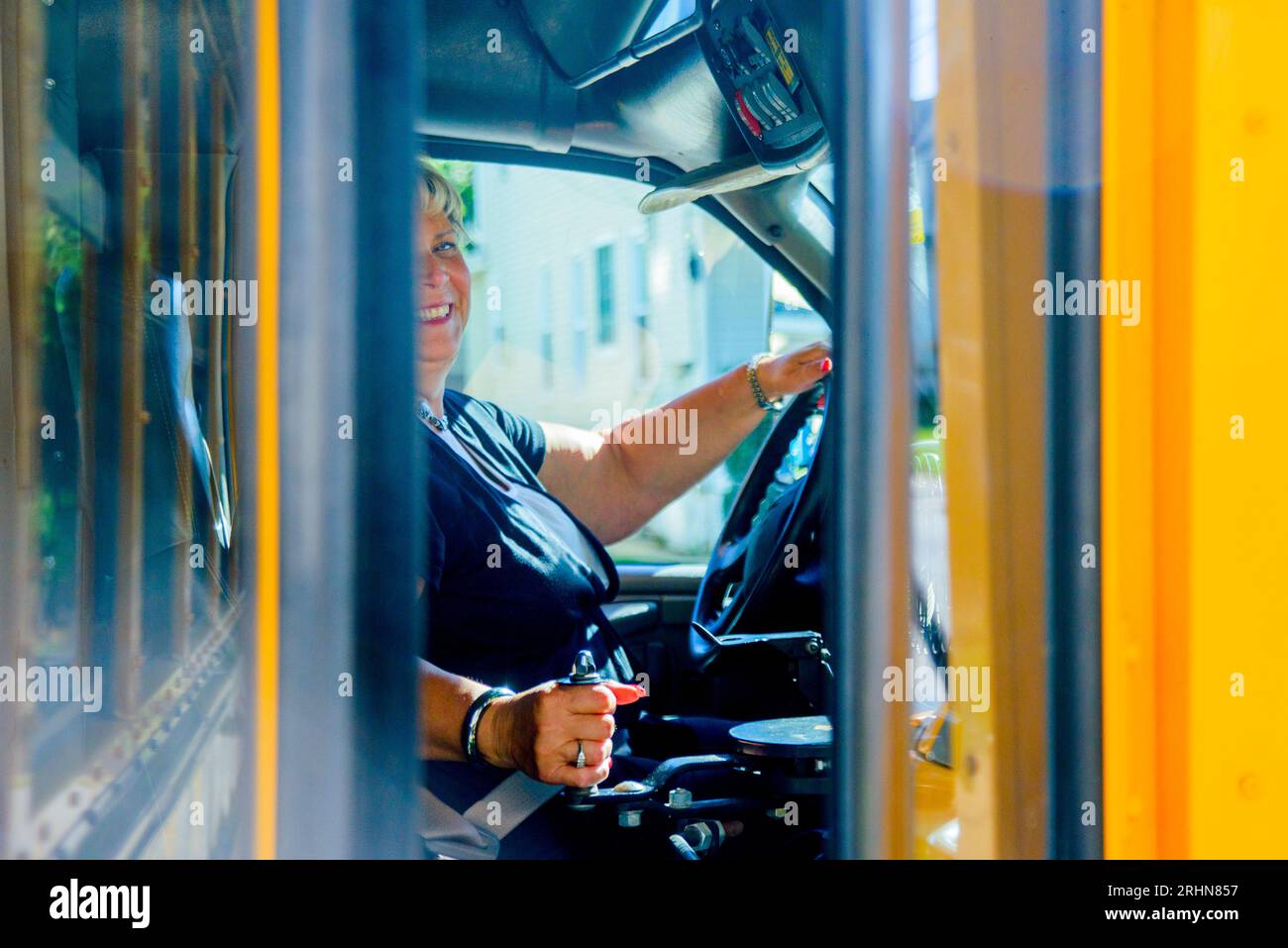 The friendly school bus driver Stock Photo