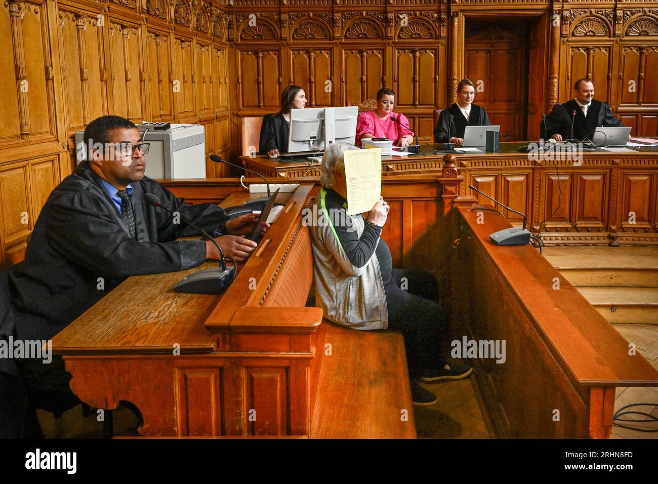 Bremen, Germany. 16th Aug, 2023. The defendant (M) appears in the courtroom with his lawyer (l). The public prosecutor accuses the 73-year-old defendant of first choking his wife, who was lying in bed, and then hitting her on the back of the head with a CO2 cartridge in the bedroom of their shared apartment in Bremen-Nord on March 10, 2023. As a result, the wife allegedly suffered a massive, gaping crush laceration and died about three and a half hours later due to bleeding to death. Credit: Karsten Klama/dpa/Alamy Live News Stock Photo