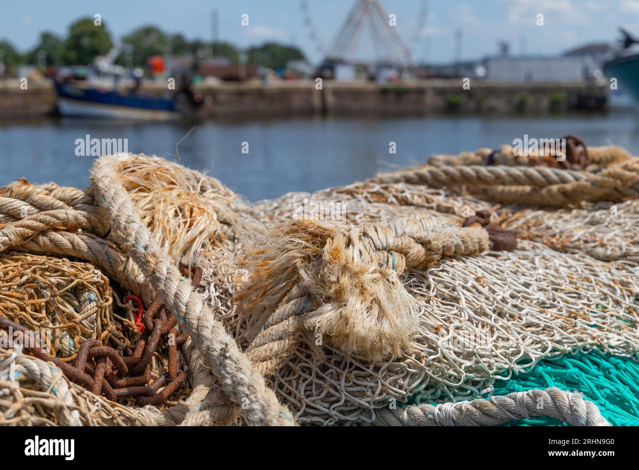 closeup of a rope and a net on a harbor Stock Photo