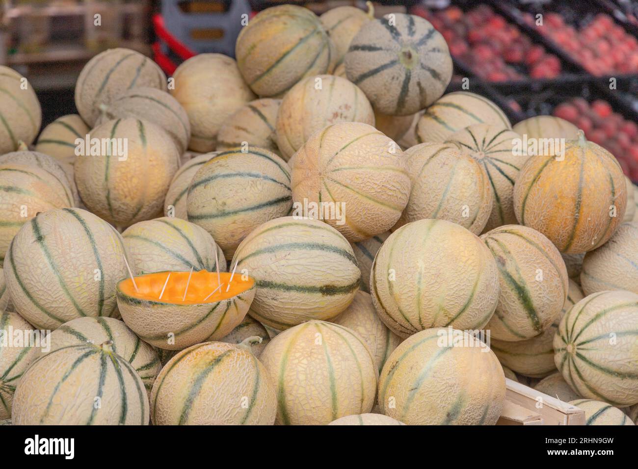 stack of yellow cantaloupes on a market Stock Photo
