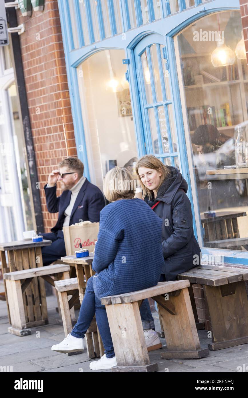 People enjoying coffee at a trendy café on Redchurch Street, Shoreditch, East London, a hub of hipster culture and creative industry Stock Photo