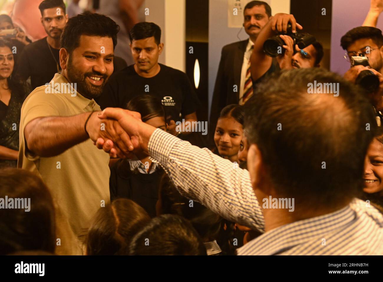 New Delhi, Delhi, India. 18th Aug, 2023. Indian Cricketer and captain of Indian Cricket Team, Rohit Sharma, interacts with people during an awareness programme on vision care by Oakley and OneSight EssilorLuxottica Foundation in Gurugram, on the outskirts of New Delhi, India on August 18, 2023. (Credit Image: © Kabir Jhangiani/ZUMA Press Wire) EDITORIAL USAGE ONLY! Not for Commercial USAGE! Stock Photo