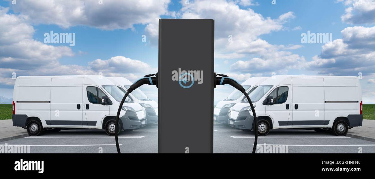Electric delivery vans with electric vehicles charging station Stock
