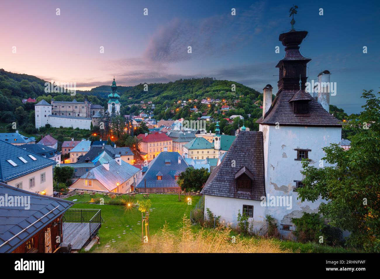 Banska Stiavnica, Slovakia. Cityscape image of historical city of Banska Stiavnica, Slovak Republic at summer sunset. Stock Photo