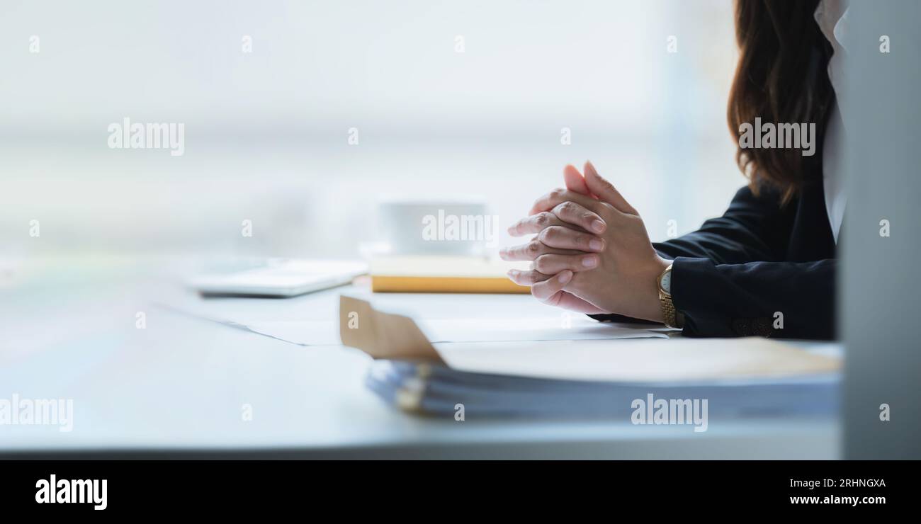 Close up clasped hands businesswomen negotiate at table, confrontation concept, negotiators conflict difficult job interview, hiring decision Stock Photo