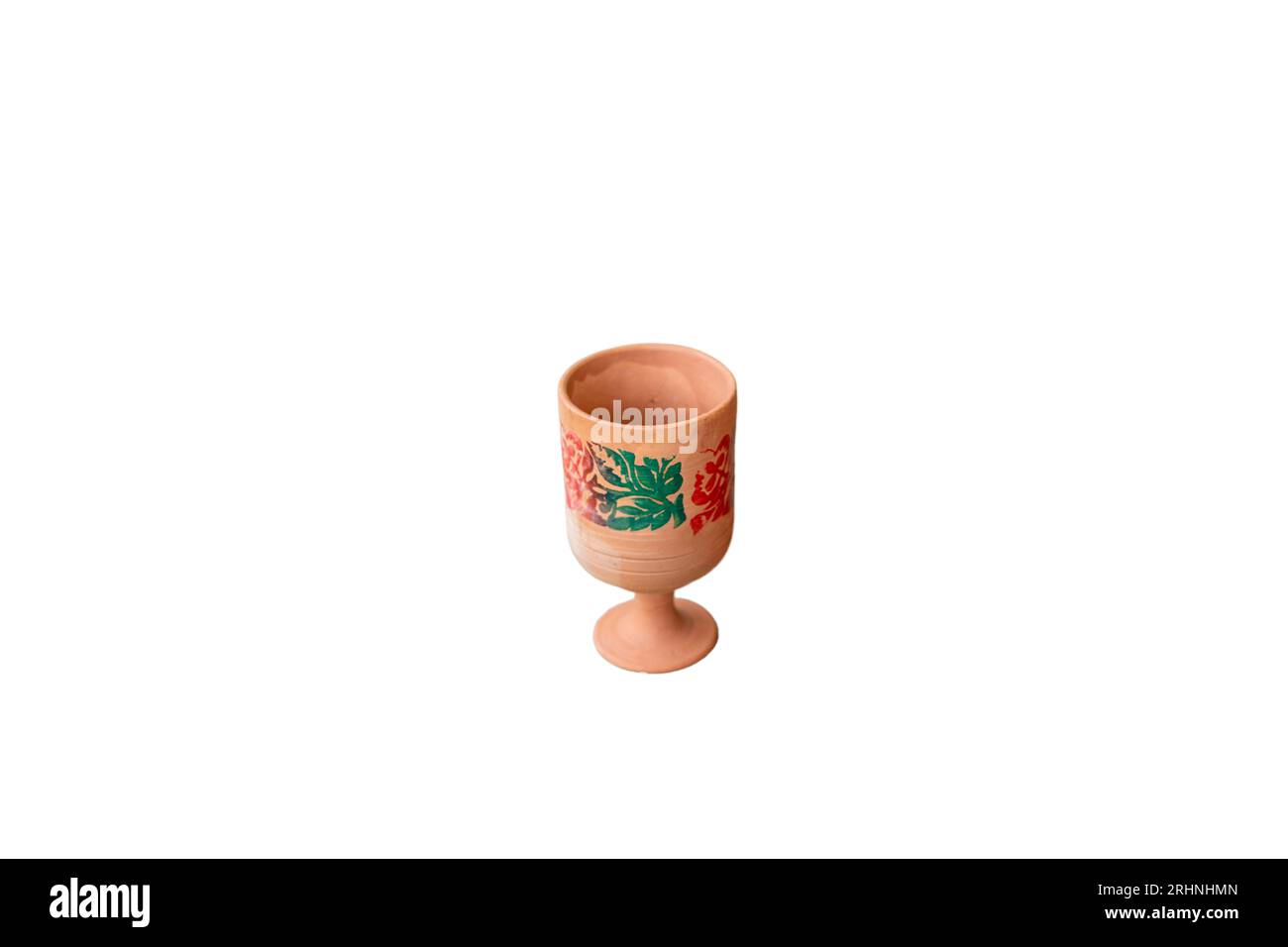 Painted clay wine glass isolated on a white background. Stock Photo
