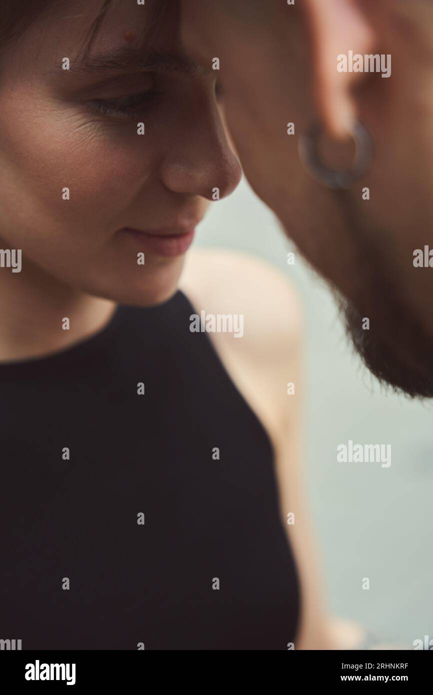 Couple in love is standing, embracing, on a city street Stock Photo