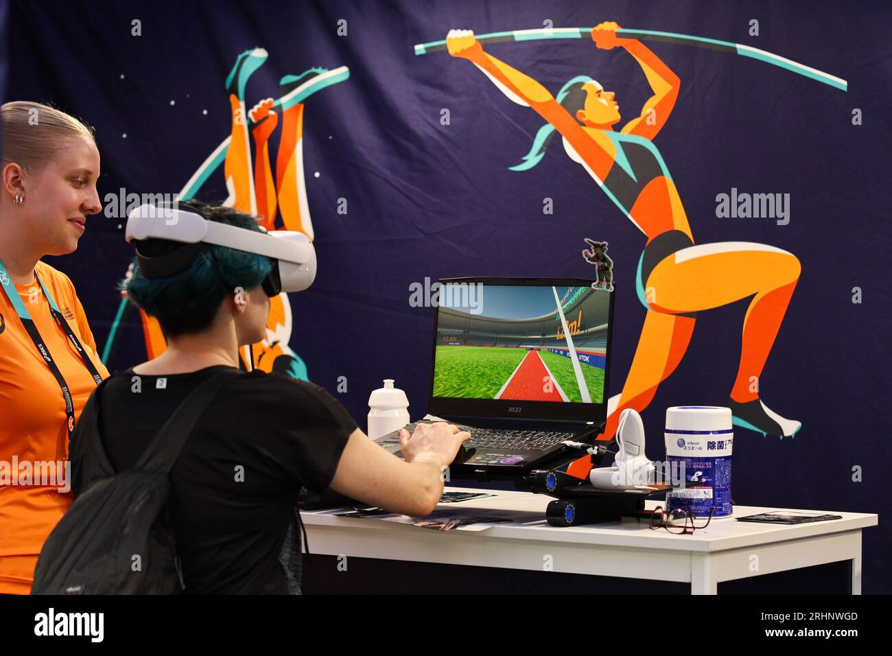 Budapest. 17th Aug, 2023. A woman enjoys the angle of an athlete via VR